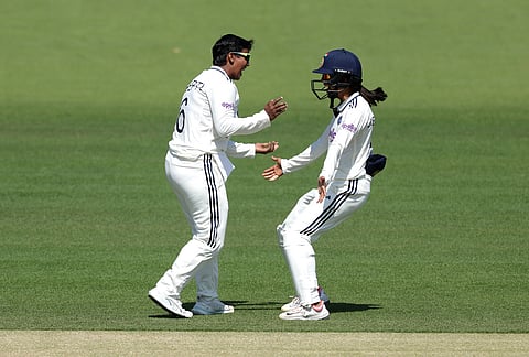 India's Deepti Sharma, left, celebrates with a teammate after bowling out England's Issy Wong during day four of the first Women's Rothesay Test cricket match between England and India in London, England, Monday, July 13, 2026.