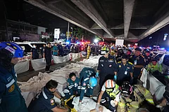 Bodies of victims of a fire are laid in a row in Bangkok | - (AP Photo/Sakchai Lalit)