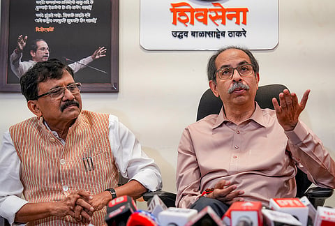 Shiva Sena (UBT) chief Uddhav Thackeray, right, along with party leader Sanjay Raut during a press conference, in Mumbai, Maharashtra.