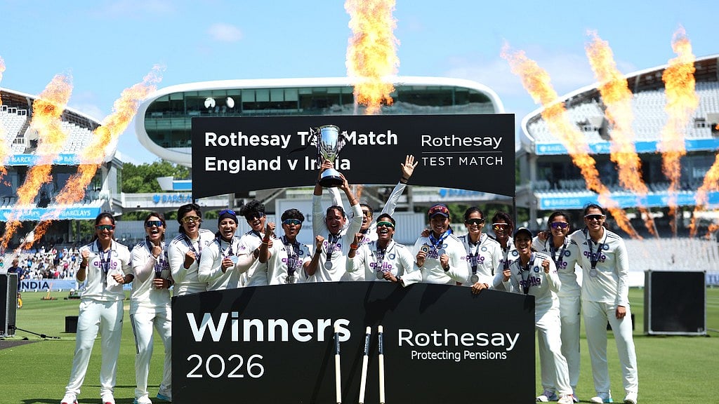 India players celebrate with the trophy following the victory in the test match during day four of the first Women's Rothesay Test cricket match between England and India in London, England, Monday, July 13, 2026.  - AP Photo/Steven Paston