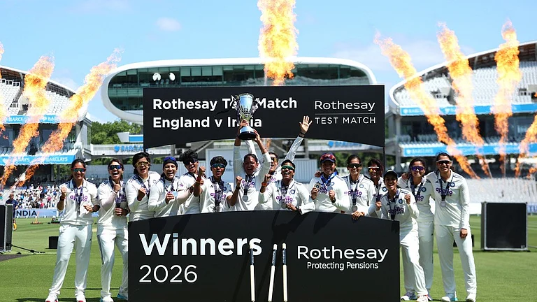 India players celebrate with the trophy following the victory in the test match during day four of the first Women's Rothesay Test cricket match between England and India in London, England, Monday, July 13, 2026. - AP Photo/Steven Paston