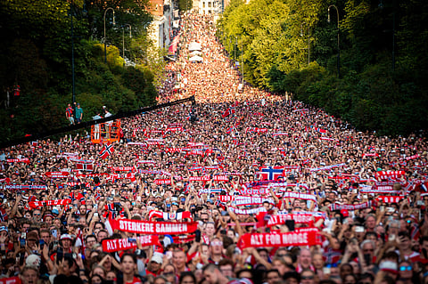 Fans stand to greet Norway's men's national soccer team at Slottsplassen after returning to Oslo, Norway, from the United States.