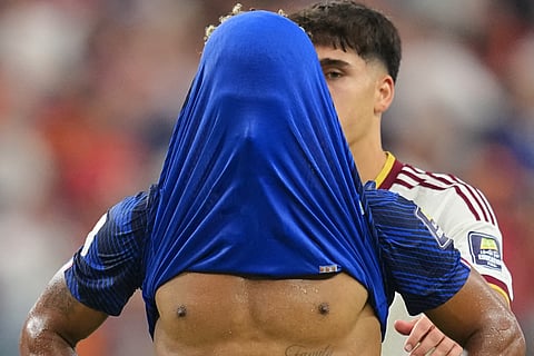 France's Desire Doue covers his face after his side's lost against in a World Cup semifinal soccer match in Arlington, Texas