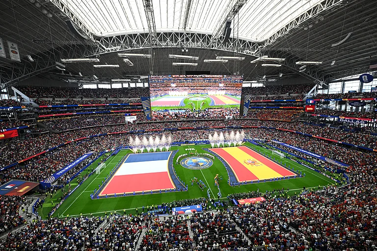 The flags of France, left, and Spain are displayed before the World Cup semifinal soccer match in Arlington - AP/Jessica Tobias