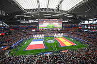 AP/Jessica Tobias : The flags of France, left, and Spain are displayed before the World Cup semifinal soccer match in Arlington