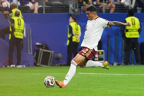 Spain's Pedro Porro (12) scores his side's 2nd goal during the World Cup semifinal soccer match between France and Spain