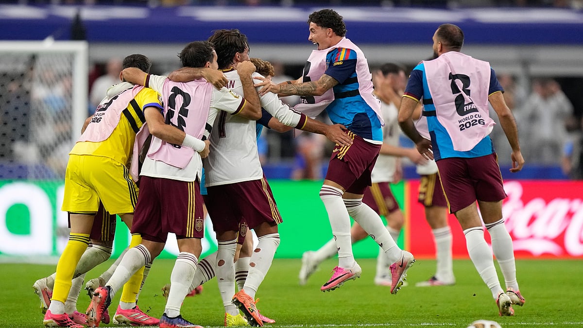 Spain players celebrate at the the end of the World Cup semifinal soccer match between France and Spain in Arlington, Texas - AP/Ashley Landis