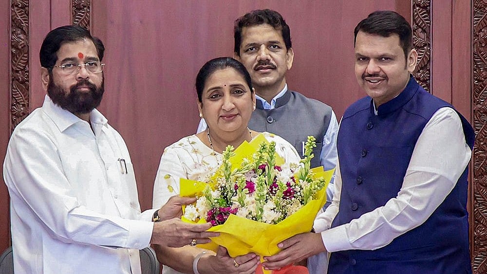 Maharashtra Chief Minister Devendra Fadnavis (R) Deputy Chief Minister Eknath Shinde (L) Deputy Chief Minister Sunetra Pawar (C) - | Photo: @CMOMaharashtra/X via PTI 