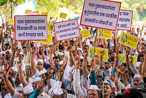 Pan Vyapari Mahasangh members hold placards as they stage a protest and observe a statewide 'Bandh' against the alleged misuse of MCOCA and FDA provisions, revocation of the flavoured tobacco ban and financial support for traders, at Azad Maidan, in Mumbai.