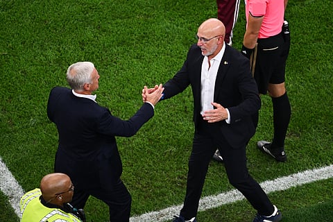 France head coach Didier Deschamps, left, greets Spain head coach Luis de la Fuente after Spain defeated France