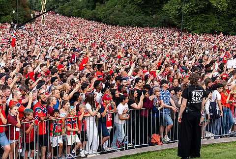 Fans stand to greet Norway's men's national soccer team at Slottsplassen after the team returned to Oslo, Norway, from the United States, Monday, July 13, 2026. 