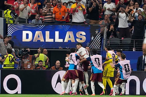 Spain players celebrate their side's second goal during the World Cup semifinal soccer match between France and Spain