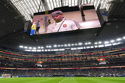 Spain's Lamine Yamal is seen on the big screen as he arrives prior to the World Cup semifinal soccer match
