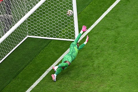 France goalkeeper Mike Maignan (16) can't stop a penalty kick by Spain's Mikel Oyarzabal for their first goal
