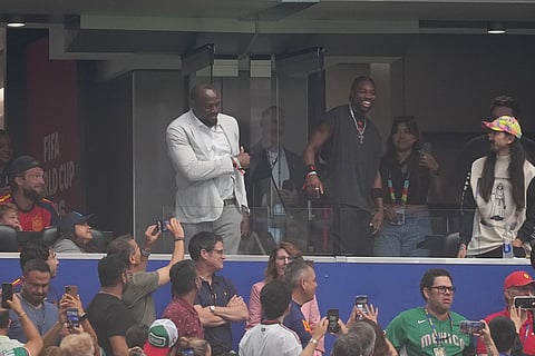 Jamaican sprint great Usain Bolt greets fans before the World Cup semifinal soccer match between France and Spain in Arlington,