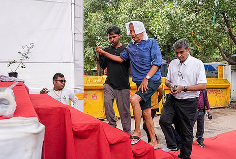 Climate activist Sonam Wangchuk being attended by medical professionals during a protest by Cockroach Janata Party (CJP) demanding Union Education Minister Dharmendra Pradhan's resignation over alleged irregularities in the NEET examination, at Jantar Mantar, in New Delhi. Wangchuk has been on an indefinite hunger strike for 17 days. 