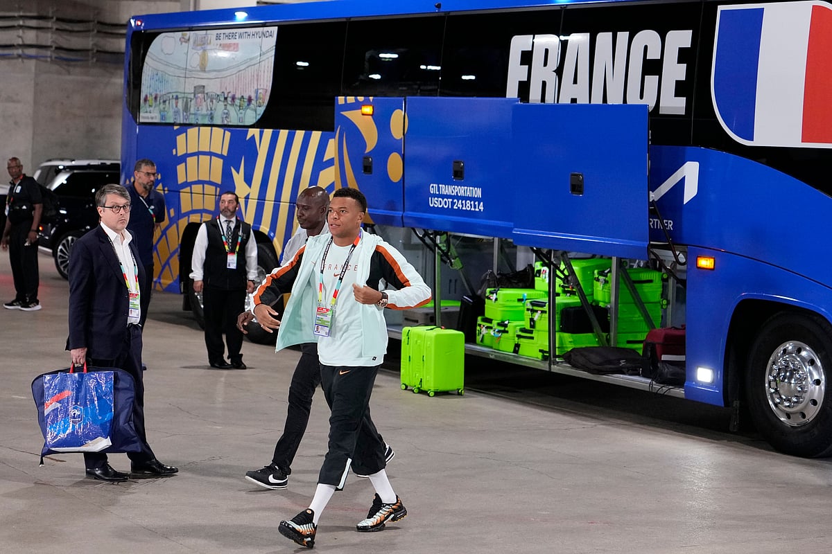 France's Kylian Mbappe (10) arrives at the stadium before the World Cup semifinal soccer match between France and Spain - AP