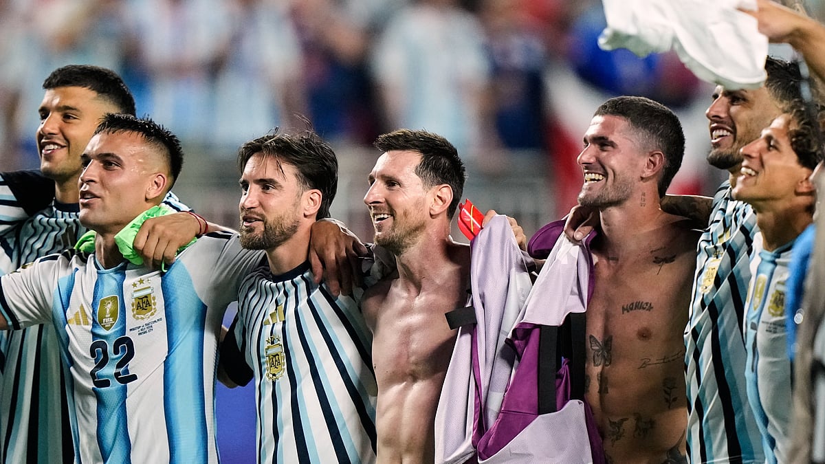 Argentina's Lionel Messi, center, and teammates celebrate their victory over Switzerland in the World Cup quarterfinal - AP