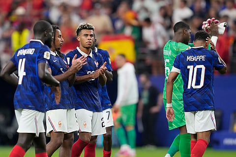 France players applaud after the World Cup semifinal soccer match between France and Spain in Arlington, Texas