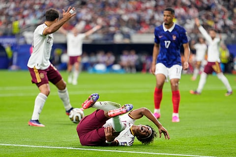 Spain's Lamine Yamal (19) reacts after a foul during the World Cup semifinal soccer match between France and Spain in Arlington