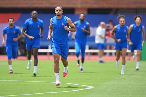 France's Maxence Lacroix participates in a training session ahead of the team's semifinal soccer match against Spain
