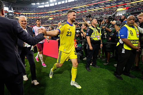Spain goalkeeper Unai Simon leaves the pitch at the the end of the World Cup semifinal soccer match