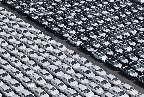 New vehicles wait to be shipped to overseas markets at a port in Shanghai, China.