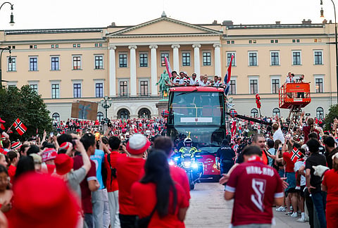 The men's national soccer team is applauded by a crowd at Slottsplassen after attending a reception with Norway's royal family, in Oslo, Monday, July 13, 2026. 