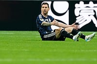 AP : Argentina's Lionel Messi on the floor during the World Cup semifinal soccer match