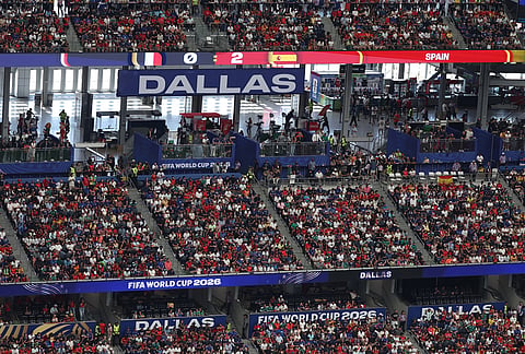 Fans watch the World Cup semifinal soccer match between France and Spain in Arlington, Texas, near Dallas, Tuesday, July 14, 2026.