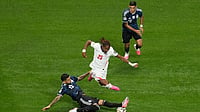 AP/Mike Stewart : Argentina's Cristian Romero (13) and England's Djed Spence (25) compete for the ball during the World Cup semifinal