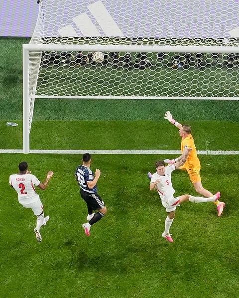 Argentina's Lautaro Martinez (22) scores their second goal during the World Cup semifinal soccer match