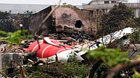 Air India 171: AAIB Cannot Share Cockpit Voice Recordings Due To Legal Bar Photo: Dinesh Parab/Outlook : The wing of Air India flight 171 lies broken in the dust, just outside Meghnagar.