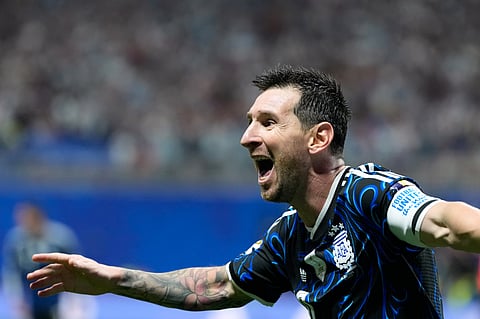 Argentina's Lionel Messi celebrates after teammate Lautaro Martinez scored their side's second goal 