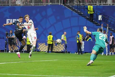 England's Anthony Gordon (18) scores the opening goal during the World Cup semifinal soccer match 