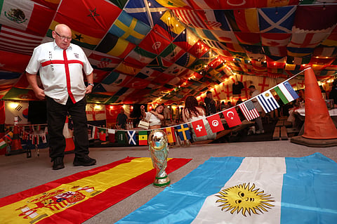An England supporter looks at the flag of Spain and Argentina after the World Cup semifinal soccer match between England and Argentina at The Clock pub in Hebburn