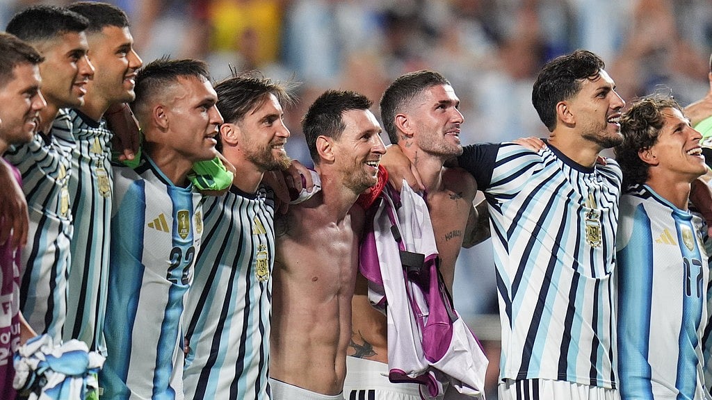 Argentina's Lionel Messi, center, reacts after the World Cup quarterfinal soccer match against Switzerland in Kansas City - Jeff Roberson/AP Photo