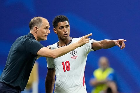 England head coach Thomas Tuchel talks to England's Jude Bellingham during the World Cup semifinal soccer match