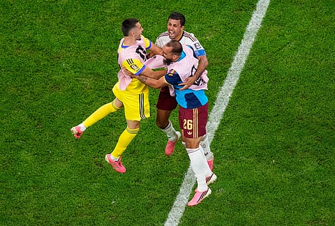 Spain's Borja Iglesias (26) celebrates with Rodri, center, after the World Cup semifinal soccer match between France and Spain in Arlington, Texas, near Dallas, Tuesday, July 14, 2026.