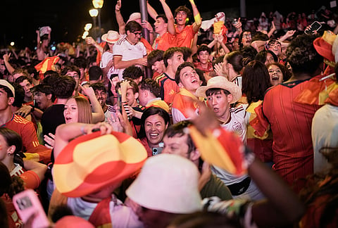 Spanish fans celebrate in central Madrid after Spain's Pedro Porro scores his side's second goal during the World Cup semifinal soccer match between France and Spain in Arlington, Texas, near Dallas, Tuesday, July 14, 2026. 