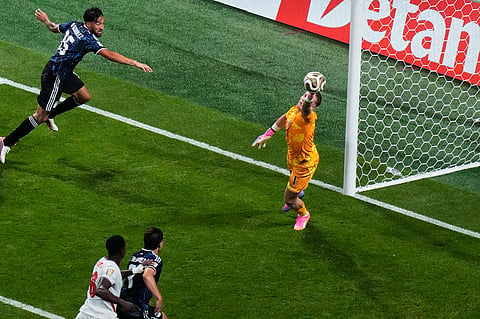 England goalkeeper Jordan Pickford (1) makes a save on a header by Argentina's Nico Gonzalez (15) during the World Cup semifinal soccer match 