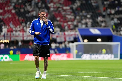 Argentina's Rodrigo De Paul leaves after a walk around the pitch before the World Cup semifinal soccer match