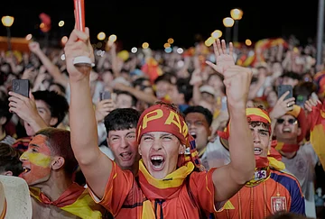 | Photo: AP/Bernat Armangue : Spanish fans celebrate in central Madrid after defeating France in a World Cup semifinal soccer match in Arlington, Texas, near Dallas, Tuesday, July 14, 2026.