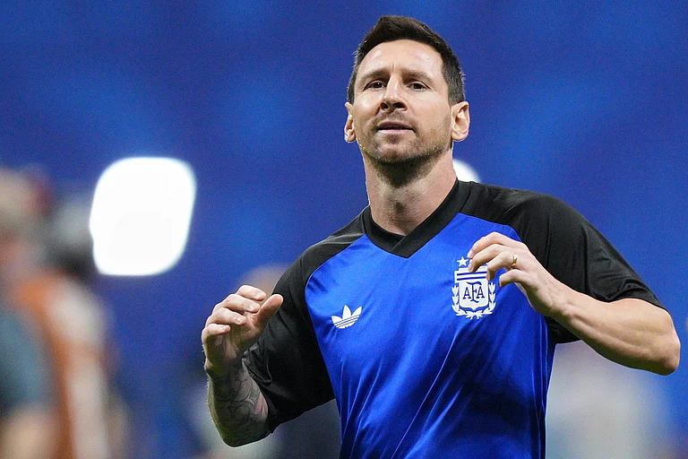 Argentina's Lionel Messi (10) warms up before the World Cup semifinal soccer match between England and Argentina in Atlanta - AP/Jacob Kupferman
