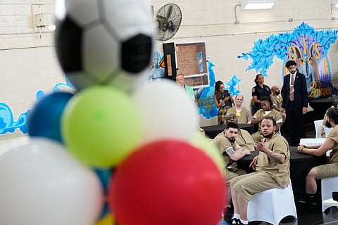 Rikers Island inmates react as they watch the World Cup semifinal soccer match between England and Argentina, at the jail complex