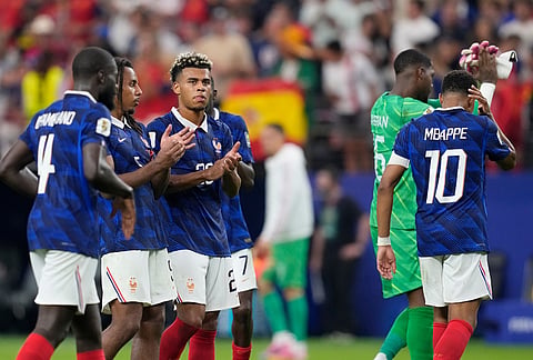 France players applaud after the World Cup semifinal soccer match between France and Spain in Arlington, Texas, near Dallas, Tuesday, July 14, 2026.