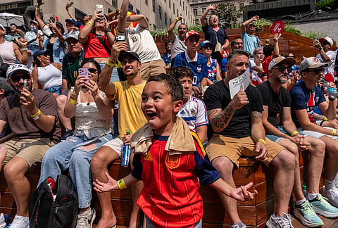 Spain fan Luca Rosas, 5, reacts as the team score their first goal during the World Cup semifinal soccer match between Spain and France at a watch party at the Rockefeller Center fan village, Tuesday, July 14, 2026, in New York.