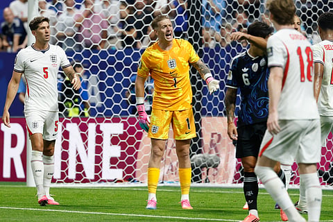 England goalkeeper Jordan Pickford (1) reacts during the World Cup semifinal soccer match between England and Argentina