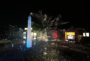 | Photo: AP/Natacha Pisarenko : Fans celebrate Argentina's victory over England in a World Cup semifinal soccer match around the Obelisk in downtown Buenos Aires, Argentina, Wednesday, July 15, 2026.
