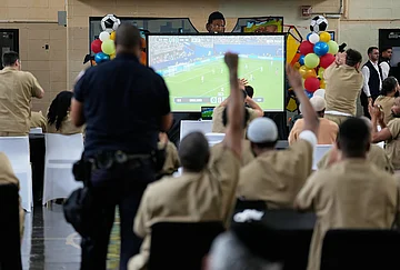 | Photo: AP/Seth Wenig : Rikers Island inmates react as New York City Mayor Zohran Mamdani, not pictured, leaves the jail complex during a World Cup semifinal soccer match watch party for the game between England and Argentina, in New York, Wednesday, July 15, 2026.